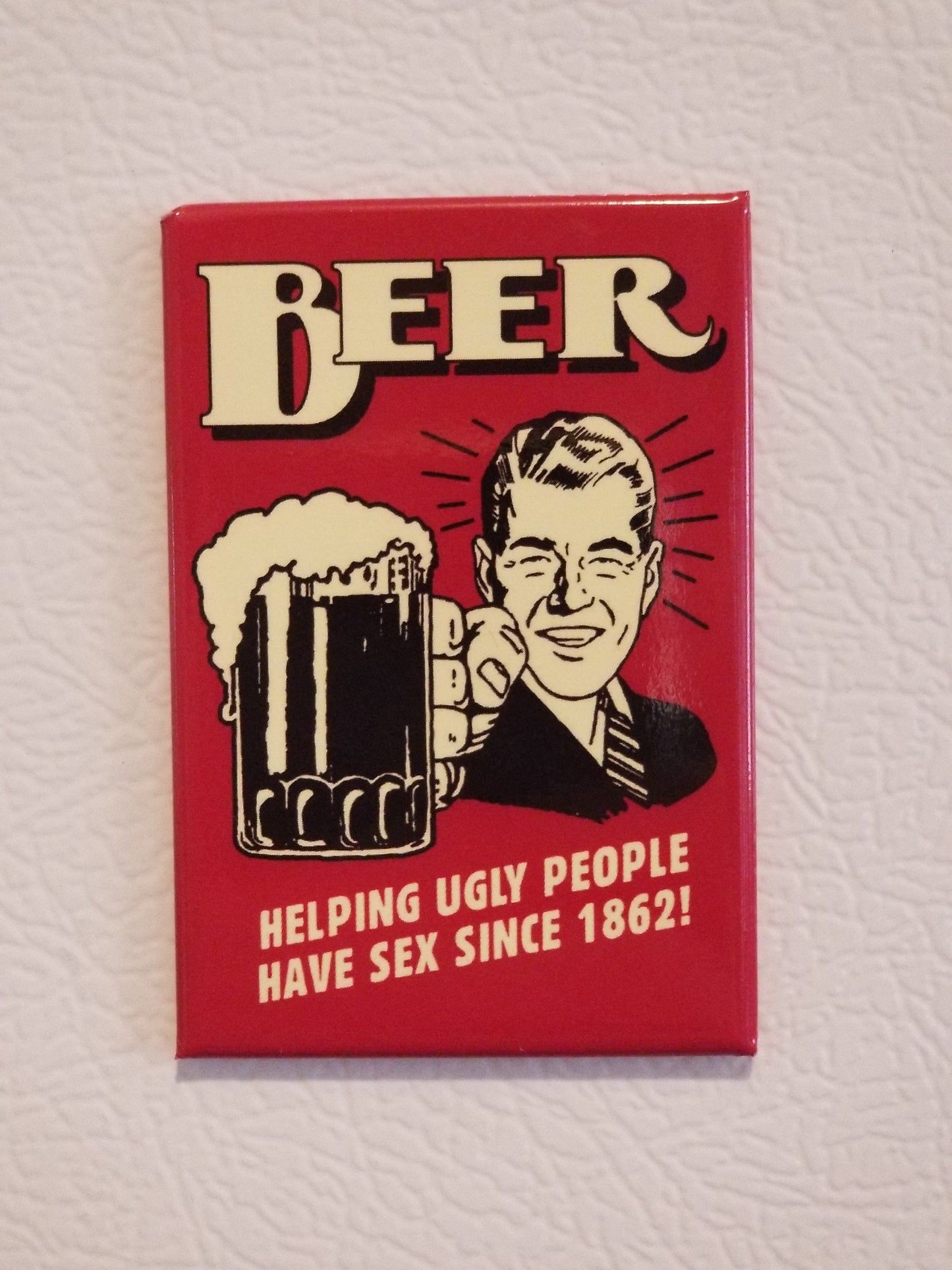 Beer Helping Ugly People Since 1862 on a 2x3 Refrigerator Magnet with Glossy Finish.A Funny Gift For Mom or Dad.