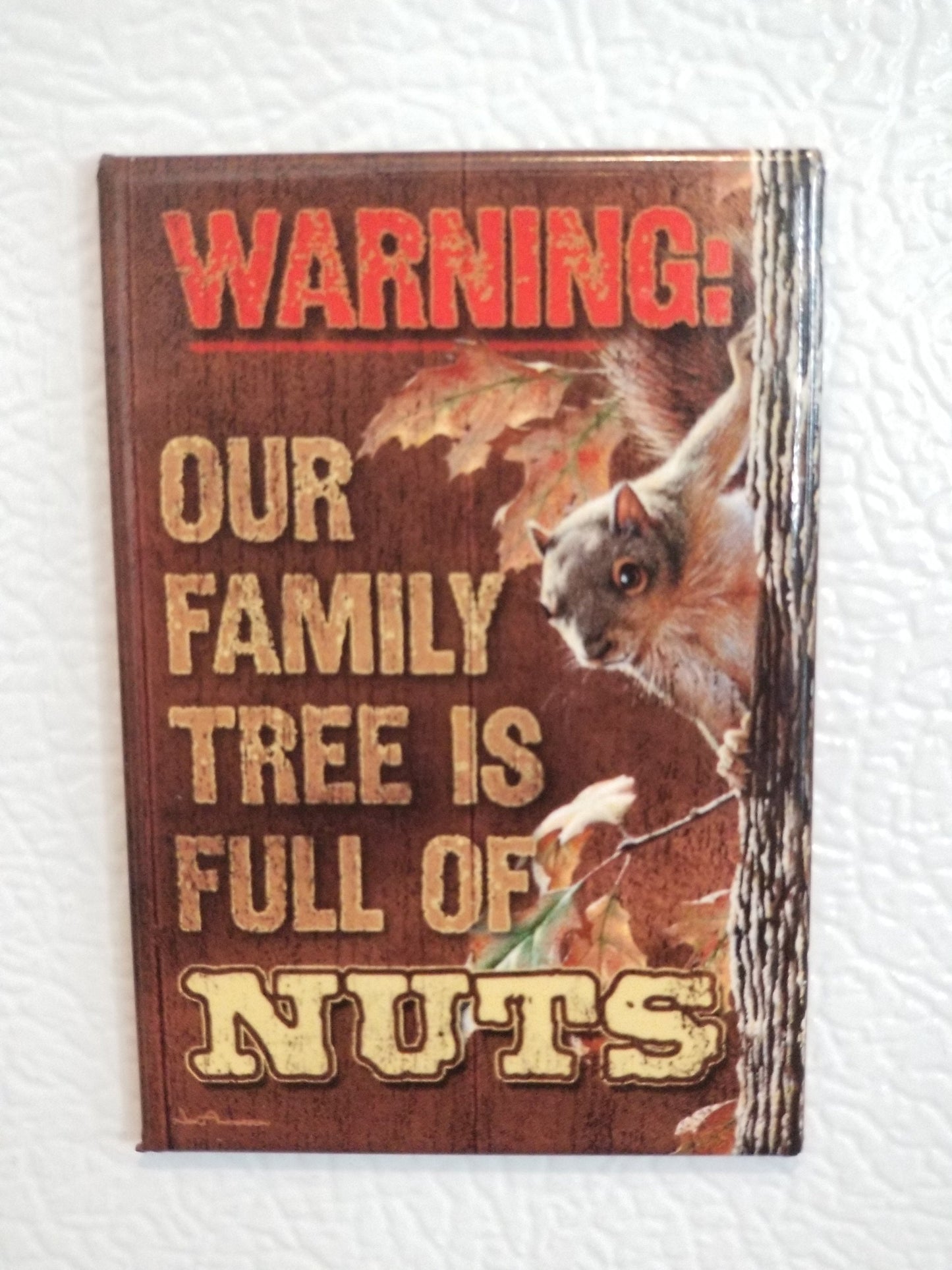 Warning Our Family Tree Is Full of Nuts on a 2x3 Refrigerator Magnet with Glossy Finish.Quality steel construction