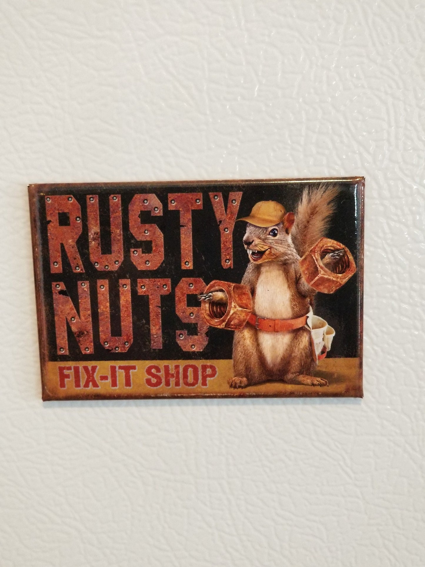 Rusty  Nuts Fix It Shop on a 2x3 Refrigerator Magnet with Glossy Finish.Quality steel construction