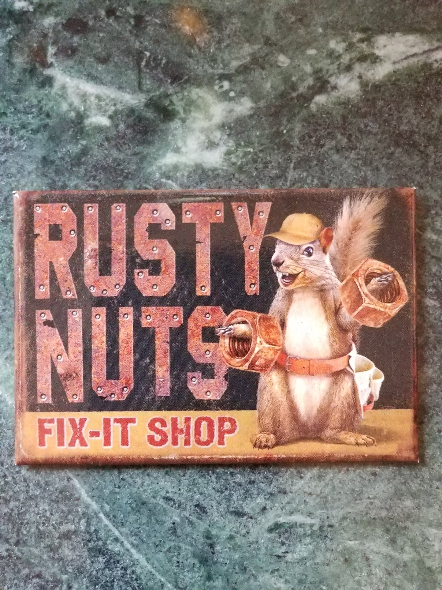 Rusty  Nuts Fix It Shop on a 2x3 Refrigerator Magnet with Glossy Finish.Quality steel construction