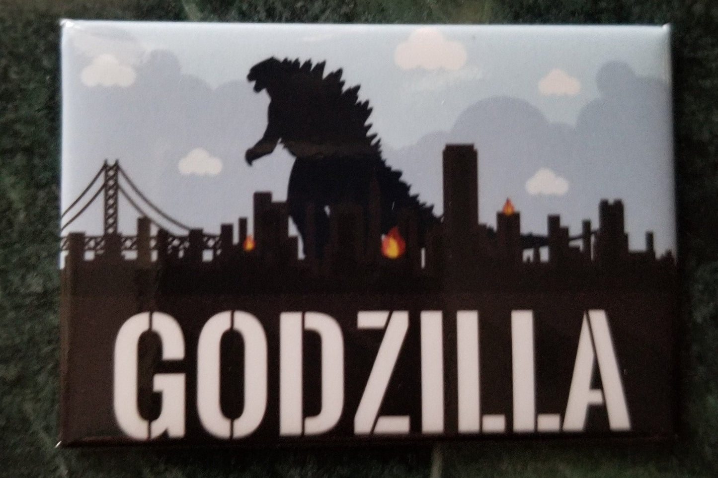 Godzilla Wreaking Havoc a 2x3 Refrigerator Magnet.The Magnet is Steel Construction With Glossy Finish.A Gift For Him or Her.